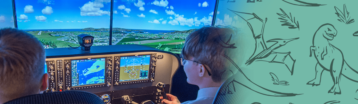 two children at the controls of the flight simulator