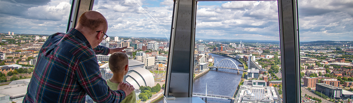 A parent and child enjoying the view from Glasgow Tower