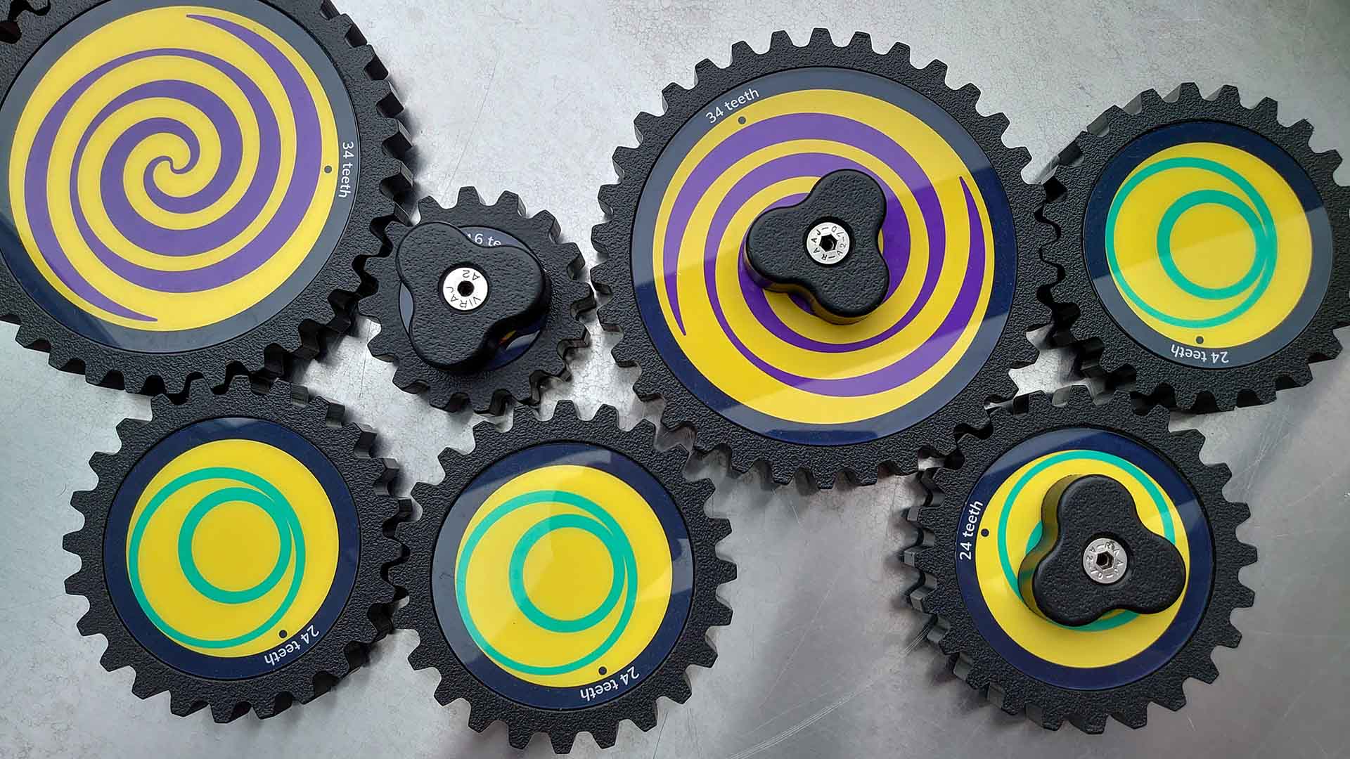 cogs assembled on a silver-coloured worktop