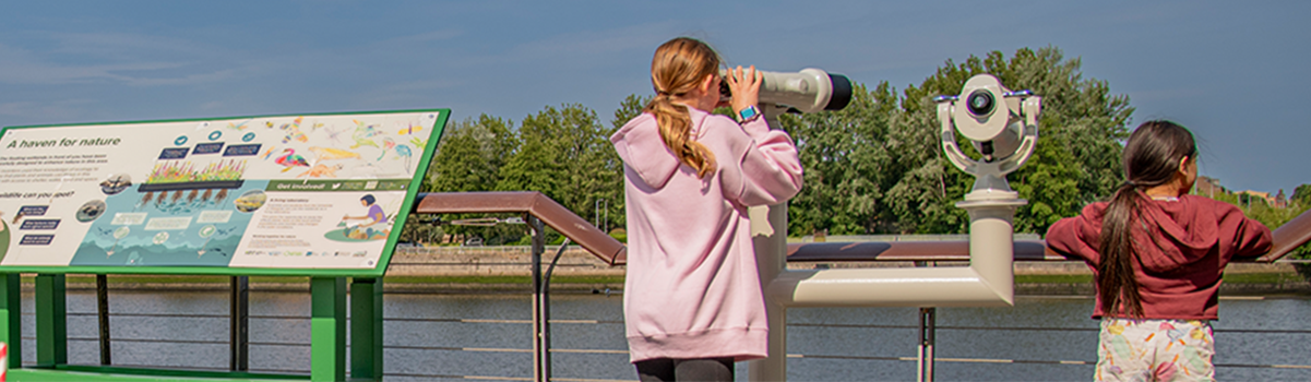 two children over looking the floating wetlands