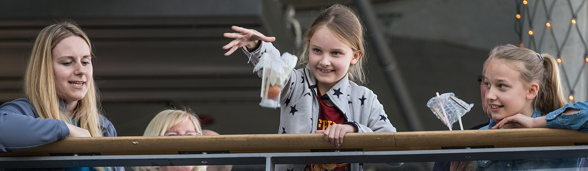 Two children test their egg drop creations