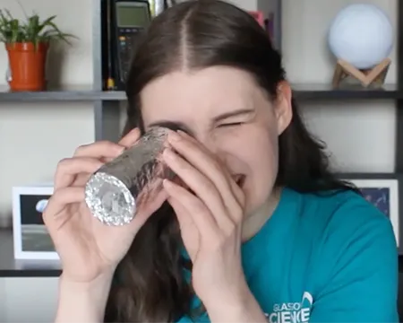 Presenter Natalie looks through a pinhole camera