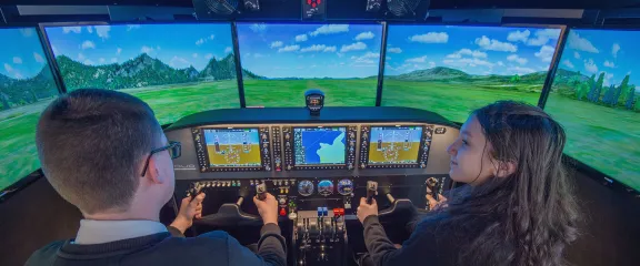 School pupils at the controls of a flight simulator