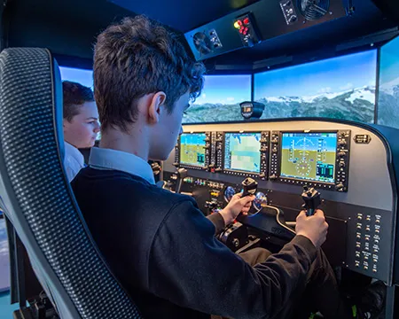 Pupils at the controls of a flight simulator