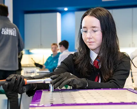 A pupil in an engineering workshop