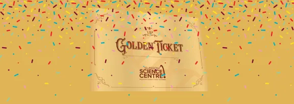 Golden Ticket and tickertape against golden background