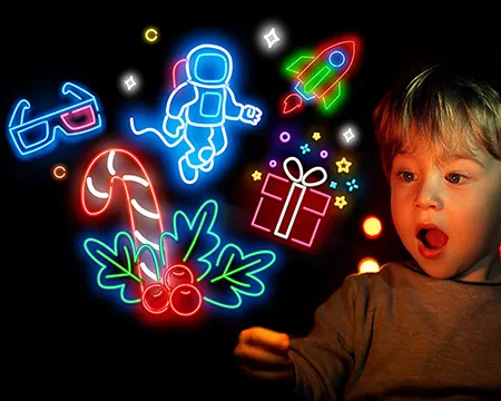 A young boy gazes in amazement at neon icons representing experiences at Glasgow Science Centre