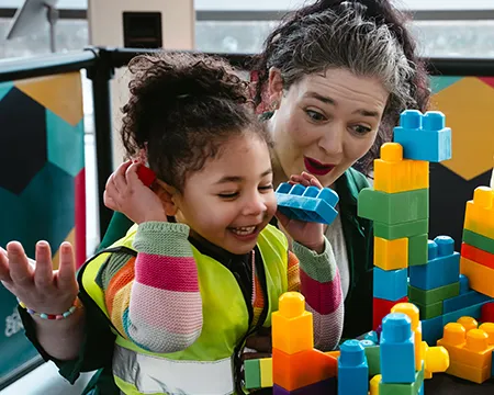 Child and adult interact with a meet the expert activity