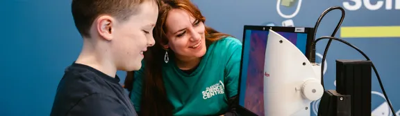 an expert demonstrates their activity to a child