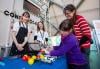 Visitors and experts at a tabletop activity